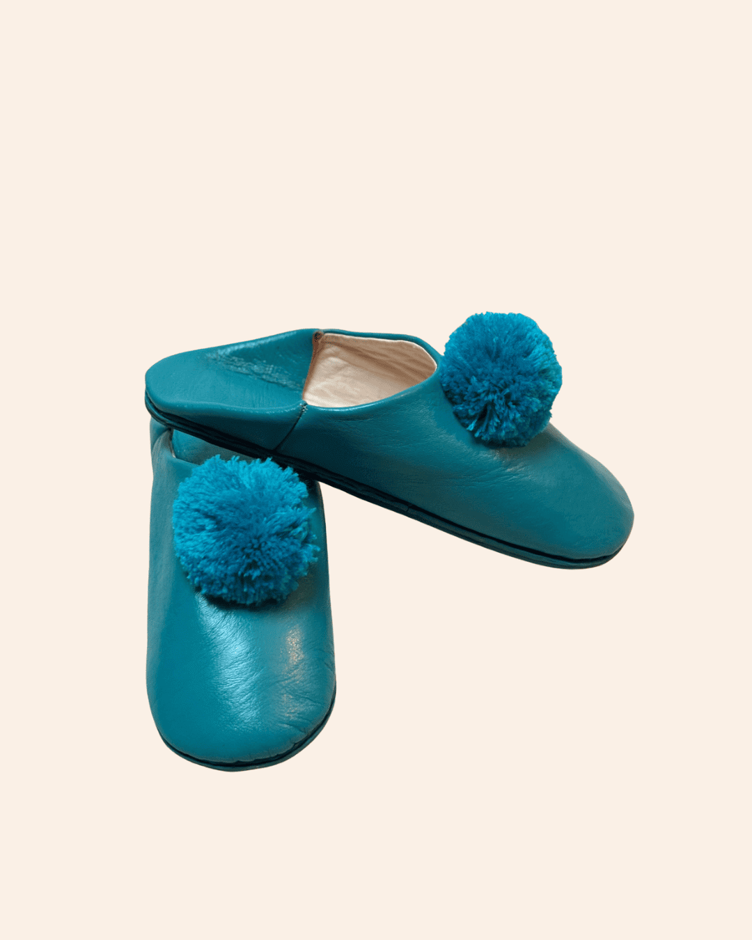 Babouches cuir à pompons